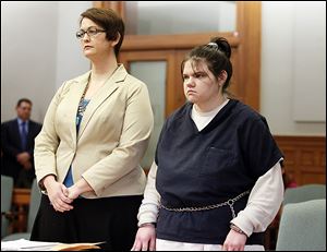 Jennelle McGuire, 20, with attorney Gretchen DeBacker, enters an Alford plea and is sentenced today in Lucas County Common Pleas Court. 