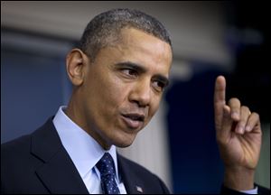 President Barack Obama gestures as he speaks to reporters in the White House briefing room today, following a meeting with congressional leaders regarding the automatic spending cuts.