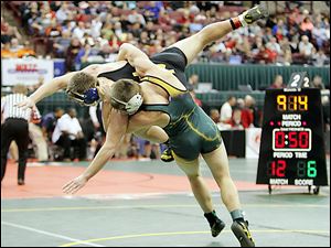 Clay’s Nick Stencel throws Cincinnati Moeller’s Dakota Sizemore to the mat during their 160-pound semifinal match. Stencel, who lost 17-7, is now 43-11 this season.