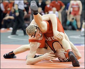 Wauseon’s Aaron Schuette, left, battles Alec Schenk of Perry for a take down during their 160-pound semifinal. Schuette won 4-2.