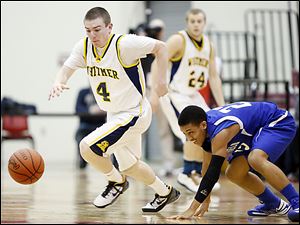 Whitmer's Luke Hickey, left, steals the ball from Springfield's Markese Hicks in Friday night's sectional.