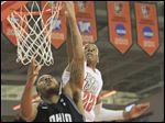  BGSU's (22), Richaun Holmes, blocks the shot of OU's (30), Reggie Keely in the first half.