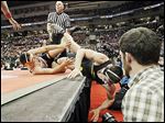 North Baltimore’s Dalton Ismael, left, rolls Tyler Beck of Galion Northmor off the mat during their Division III 195-pound championship match at the Schottenstein Center. Beck won in OT.