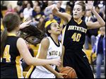  Notre Dame's Jayda Worthy goes to the net against  Northview's Kendall McCoy (40). Worthy led the Eagles with 19 points.