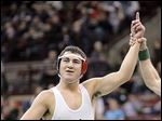  Oak Harbor wrestler Luke Cramer celebrartes after defeating Wyatt Running of Clarksville Clinton-Massie to win the D-II title at 170 pounds.
