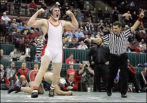 Wauseon's Zane Krall lets out a scream after scoring a takedown on Greg Moray of Steubenville to win their Division II 220-pound championship match.