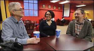 Peru native Lucy Mendoza meets with her former Toledo Early College teachers Randy Nissen, left, and Nick Muehling at Biggby Coffee.