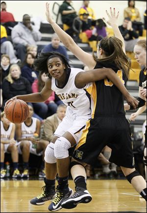 Notre Dame's Tierra Floyd (31) drives against  Sylvania Northview's Kendall Jessing (54).