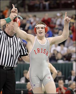 Central Catholic's Alex Mossing celebrates after defeating Ryan Skonieczny of Akron St. Vincent St. Mary during their D-II 138 pound bout.