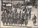  Toledo Pythians shoulder arms in Jubilee Parade. Drill team of Ramadam Temple, Dramatic Order, Knights of Khorassan, swings down Jefferson Ave. with Irving P. Miller, Lambertville, Mich., captain, at far right.  Note the Lorraine Hotel in background on left. Toledo Blade file photo dated May 24, 1948