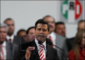 Mexico's President Enrique Pena Nieto delivers a speech during the national convention of the Institutional Revolutionary Party (PRI) in Mexico City. Mexico's ruling party changed on Sunday its platform to allow a reform that could bring private investment into the state-owned oil monopoly, in a country where oil is a source of national pride.