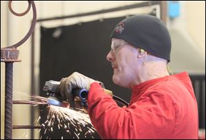 The intermediate artistic welding class at Owens Community College is taught by James Havens, a retired Ironworker.