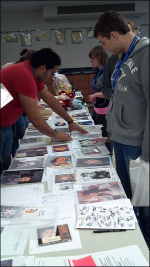 Attendees check out merchandise at the silent auction, the proceeds of which go to scholarships.