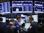  The Dow Jones industrial average finished up today, as stock traders work at the New York Stock Exchange.