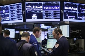 The Dow Jones industrial average finished up today, as stock traders work at the New York Stock Exchange.
