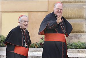 American Cardinals Justin Francis Rigali, left, and Timothy Dolan arrive at the Vatican for a first round of meetings before the conclave to elect the pope.