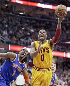 C.J. Miles shoots around New York's Amare Stoudemire. Miles scored 11 points in the home loss.