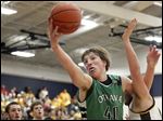  Ottawa Hills' RJ Coil (40) pulls in a rebound against Old Fort. The junior finished with 13 points and 13 rebounds in an OT win.