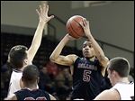  Scott's Chris Harris, who had 28 points, shoots against Otsego in a Division II district boys basketball semifinal at BGSU.