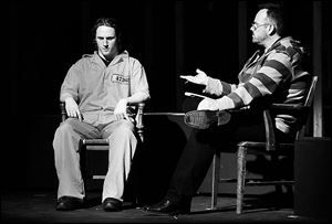 Connor Gavin plays Russell Henderson, left, being interviewed in jail by character Stephen Belber, played by Scott Heuerman, during rehearsal for the Laramie Project: 10 Years Later at the Toledo Repertoire Theatre.