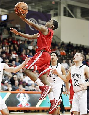 BG's LaMonta Stone takes goes to the basket in front of  Perkins' Mitchell Benkey (21) and Kyle Lewis.
