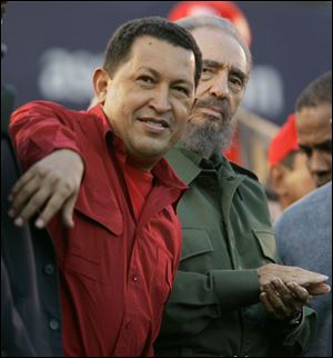 Venezuelan President Hugo Chavez, left, gestures as Cuba's President Fidel Castro looks on during an event  in Cordoba, Argentina, July, 2006.