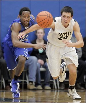 Anthony Wayne’s Ose Omofoma, left, and Perrysburg’s Nick Moschetti race after a loose ball. Moschetti scored 22 points for the Yellow Jackets, who lost to the Generals for a third time.