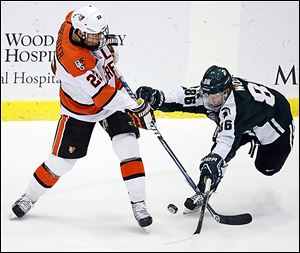 Bowling Green center Ryan Carpenter, left, and his teammates will need to win a road play­off se­ries, like the Falcons have the past two years, in order to advance in the CCHA playoffs.