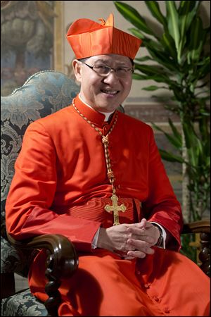 The then newly-elected Cardinal Luis Antonio Tagle, Archbishop of Manila, Philippines, posing for photographers prior to meeting relatives and friends after he was elevated to cardinal by Pope Benedict XVI, at the Vatican in November, 2012.