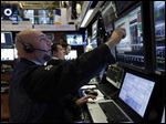  Traders work in their booth on the floor of the New York Stock Exchange Friday, March 8, 2013. Stocks are opening higher on Wall Street after the government reported a burst of hiring last month that sent the unemployment rate to a four-year low. (AP Photo/Richard Drew)