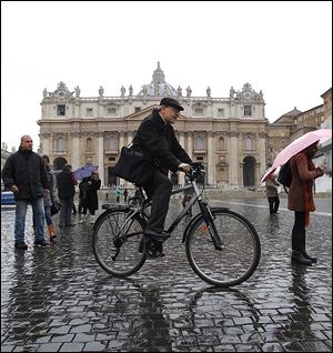 French Cardinal Philippe Barbarin crosses St. Peter's Square after a meeting.  Since Monday, cardinals have spoken on what they want to see in the next pope.  