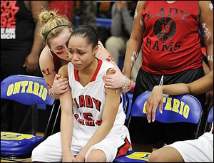 Keyanna Austin gets support from a fan after Rogers lost to Clyde in a Division II regional final. The Rams finish 22-4.