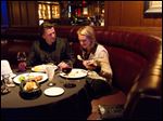  George Silva, of Toronto, left, and Maria Starrs, of Fenton, Mich., take in a meal together at the London Chop House in downtown Detroit.