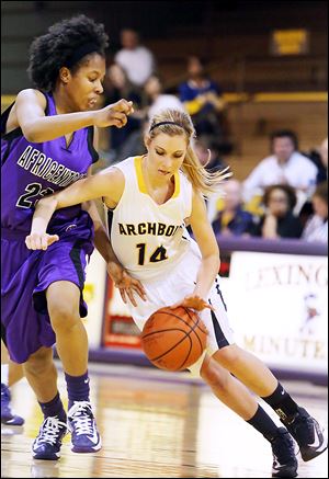 Africentric's Sierra Harley pressures Taylor Coressel in the third quarter. Coressel scored nine points in her final high school game.