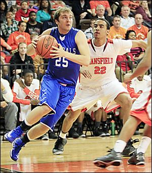 Anthony Wayne's Hunter Johnson drives around Jalen Reese.  The Generals are 20-4.