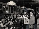  In May, 1968, customers dine under Tiffany lamps at Mancy’s Ideal Restaurant. The lamps were added, along with circus posters and a pot-bellied stove, about 1964.