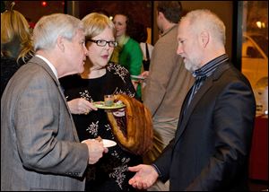 From left, Gene and Judy Pearson talk with guest speaker, award winning chocolatier, Shawn Askinoise, founder of Askinoise Chocolates.