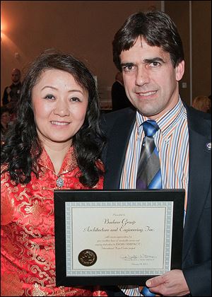 Jeff and Hong Buehrer of Buehrer Group Architecture and engineering Inc. were honored for their service to the ISOH/IMAPCT International Hope Center project.