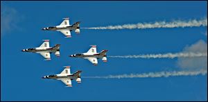 Members of the U.S. Air Force Thunderbirds perform at the Air Expo 2012 at Joint Base Lewis McChord, Wash.