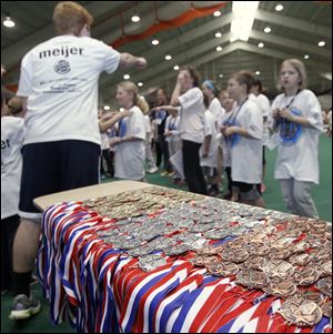Medals await the winners. Organizers said a total of 280 were awarded; youths competed in 10 events. 