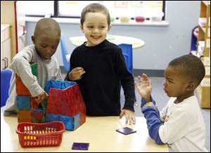 At play are Sheron Waters, 4, left, Aaron Leafgren, 5, and Loren King, 3. The nursery received the top state rating for child-care. 