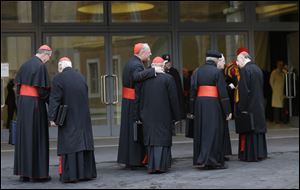 Cardinals, including U.S. Roger Mahony, left, and Timothy Dolan, third from left, arrive for a meeting at the Vatican, today.