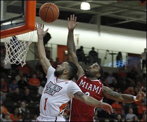 BGSU's Jordon Crawford gets his shot blocked from behind by Miami's Quinten Rollins.