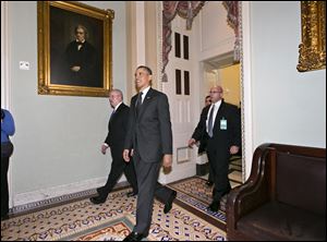 President Barack Obama leaves the Capitol in Washington, after visiting with Senate Democrats in in the first of four meetings with lawmakers this week to discuss the budget Tuesday.