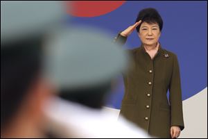 South Korean President Park Geun-hye salutes during a joint commission ceremony of 5,780 new officers of Army, Navy, Air Force and Marines at the Gyeryong military headquarters in Gyeryong, South Korea, last Friday.