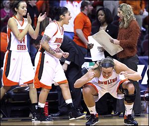 Jill Stein, right,  celebrates the Falcons' win over Western Michigan after she helped force a key turnover in the final seconds.