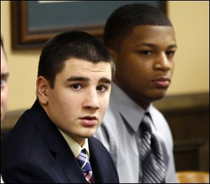 Trent Mays, 17, left, and 16-year-old Ma'lik Richmond sit at the defense table before the start of their trial on rape charges in juvenile court today in Steubenville, Ohio.