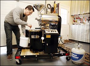 Richard Jambor of the Maddie & Bella Coffee Co. roasts coffee beans in his garage in Perrysburg.