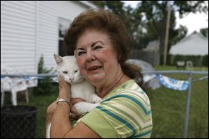 Republican mayoral candidate Opal Covey and her cat Tink at home in Toledo.
