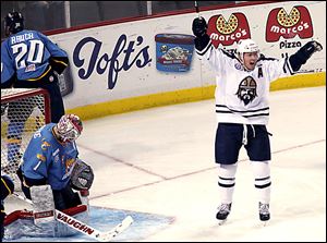 Walleye goaltender Jordan Pearce hangs his head after Greenville’s Brandon Wong scores in the first period.